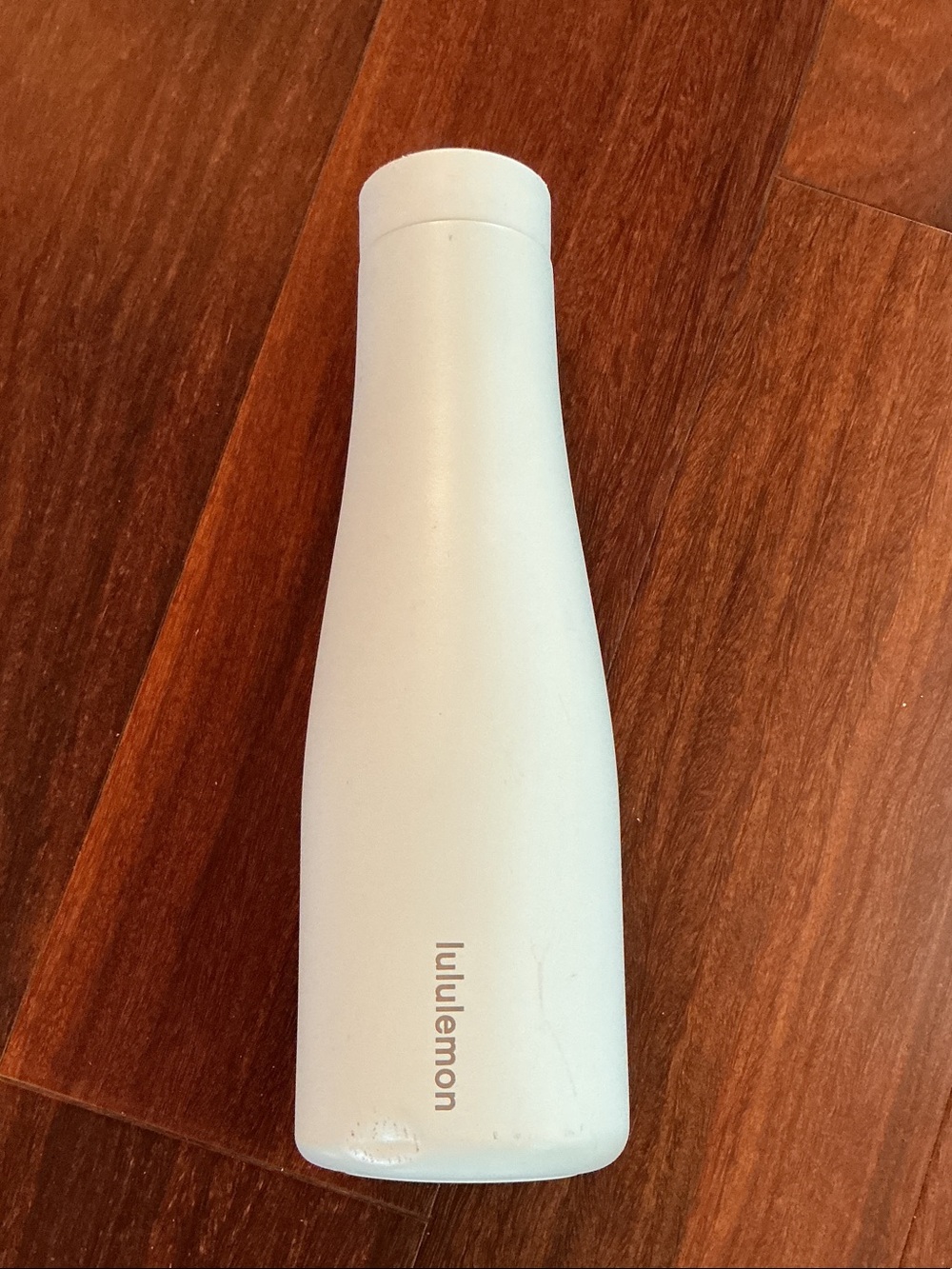 lululemon white refillable skincare bottle